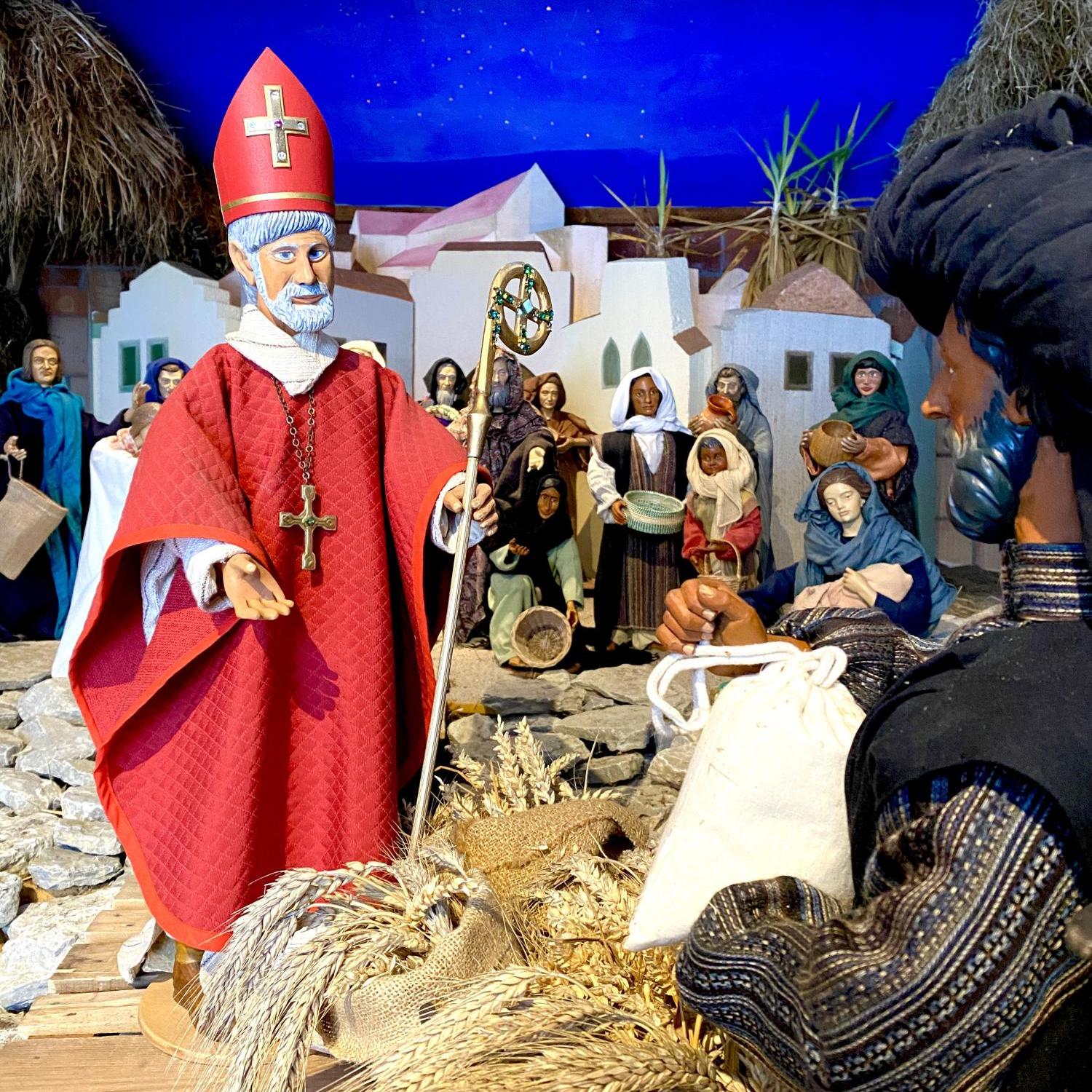 St. Nikolaus von Myra verschenkt Kornsäcke am Hafen